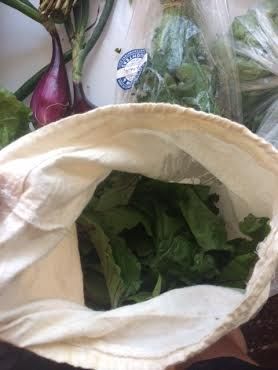 Some of the hardier greens (these are beet leaves) we store in cotton bags so they stay dry